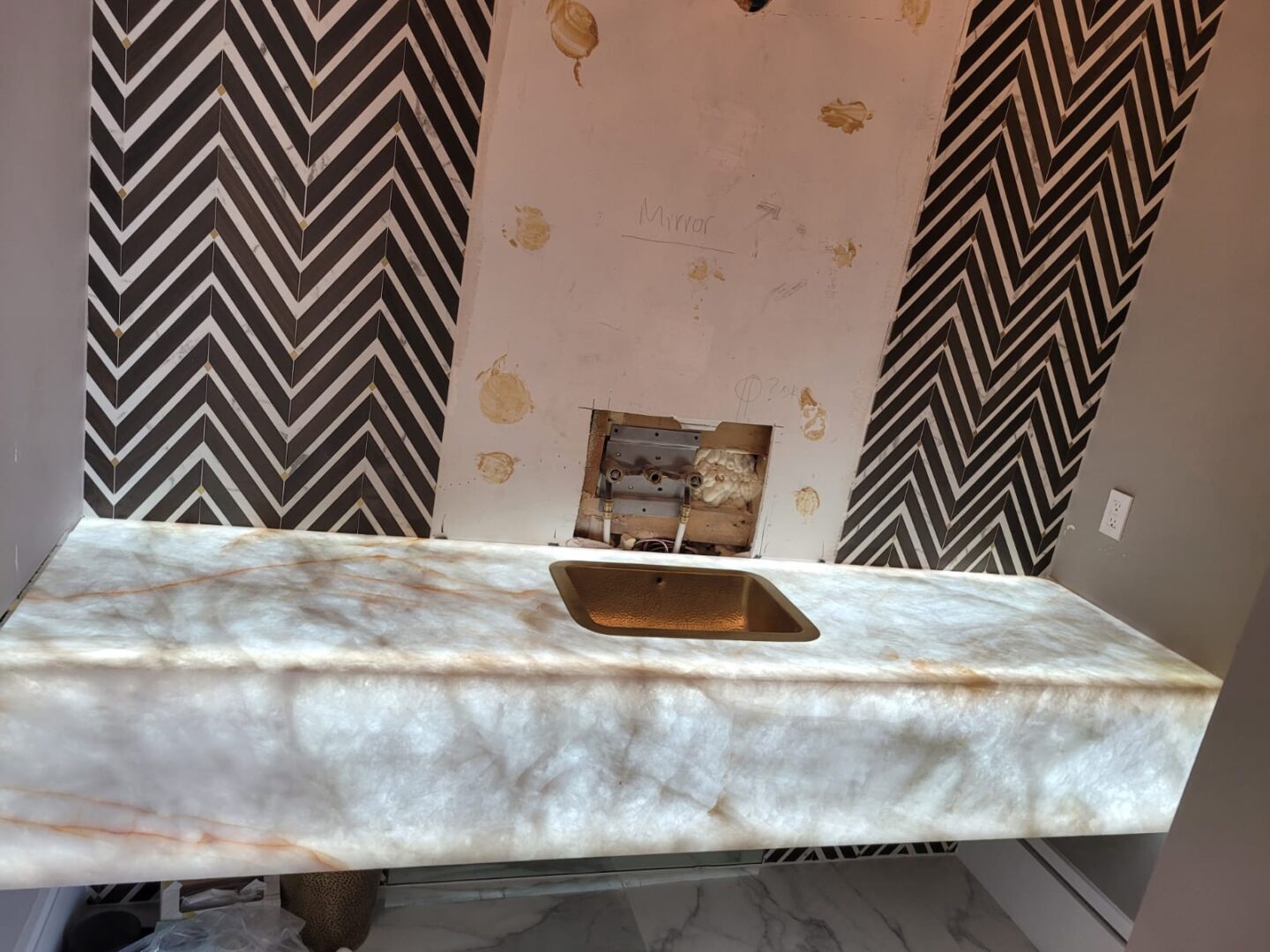 A bathroom sink with a rusty metal lid.