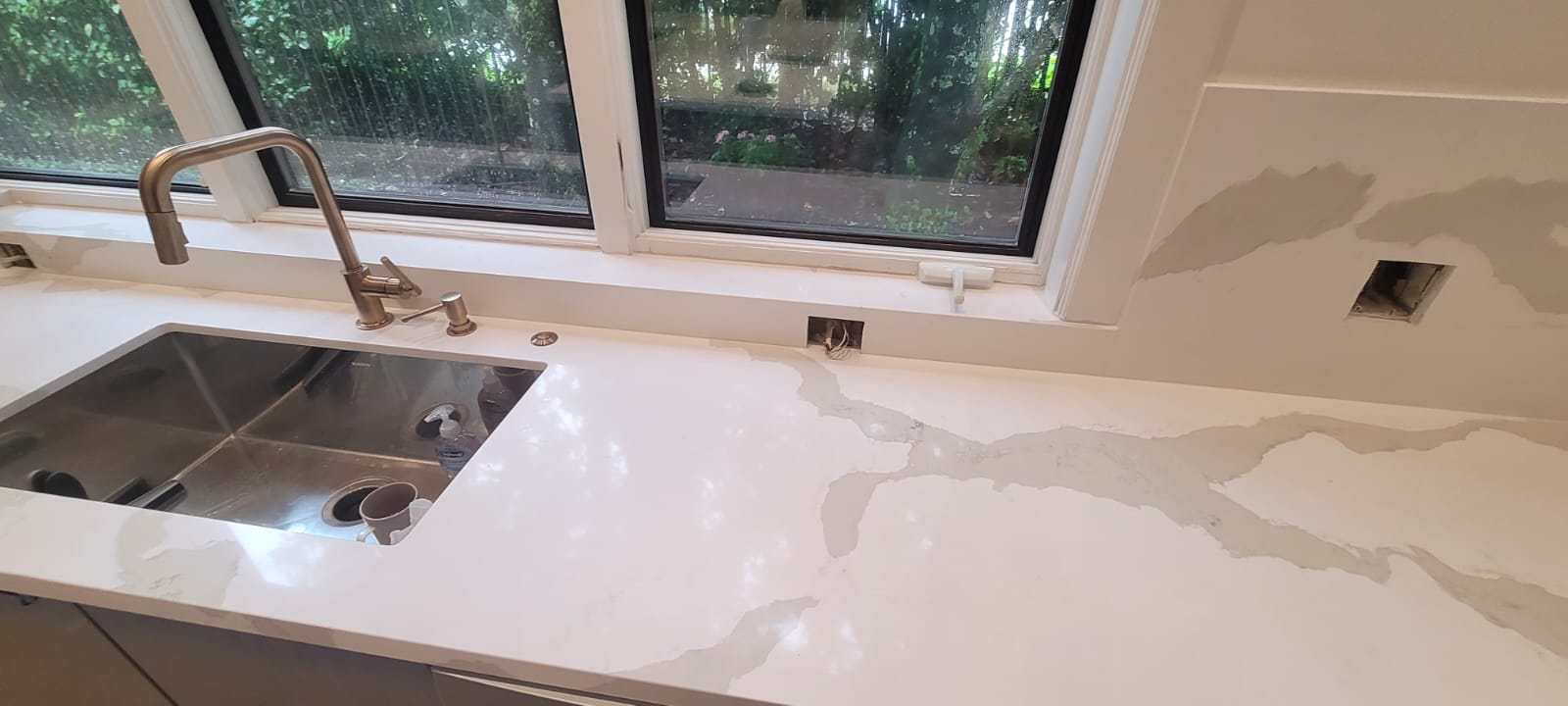 A sink with water running down the middle of it.